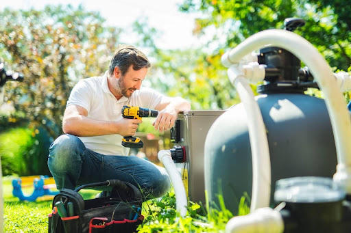 A man working on a pool's gas heating