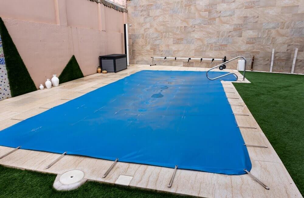 A swimming pool cover for a underground pool